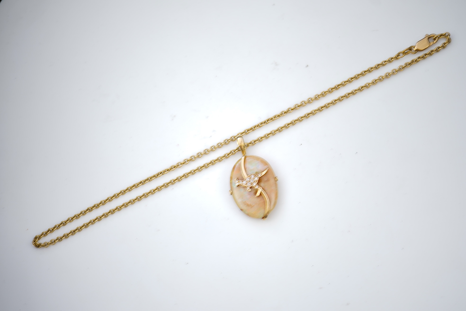 An opal and diamond pendant necklace
